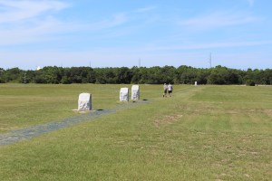 Standing at boulder, white stones mark the flight landings