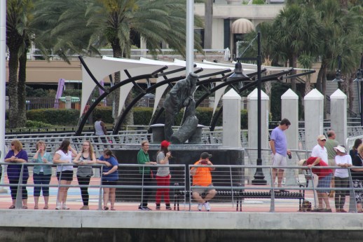 Spectators by the Statue